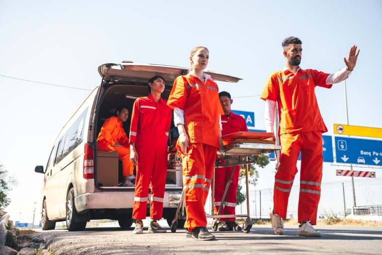 Healthcare workers rushing to aid injured victim with resuscitat Image description