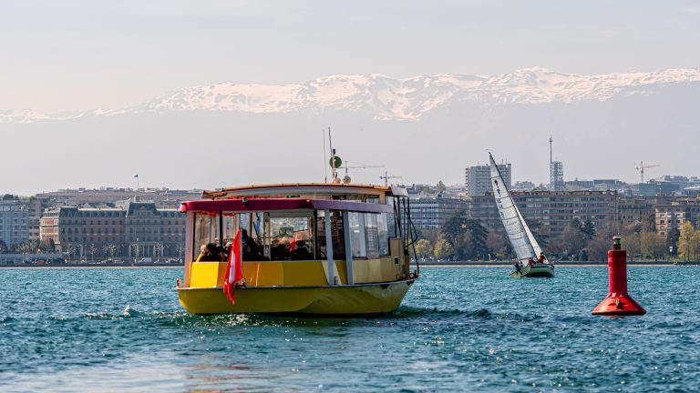 Geneva, Switzerland - April 14, 2019: View of a yellow and red M Image description